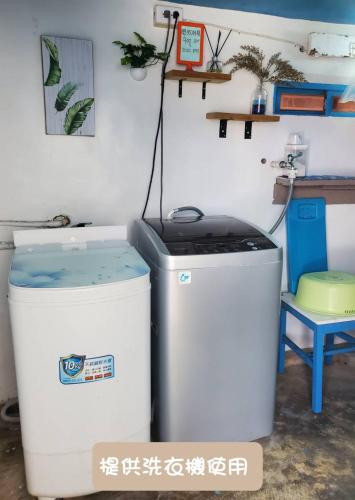 two trash cans sitting next to each other in a room at 蘭嶼 262 民宿 in Lanyu
