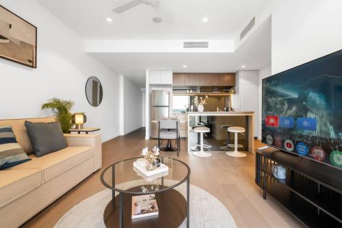 a living room with a couch and a table at 1Bedroom Apt with Sofa bed in Queen's Wharf BNE - Lv 33 in Brisbane