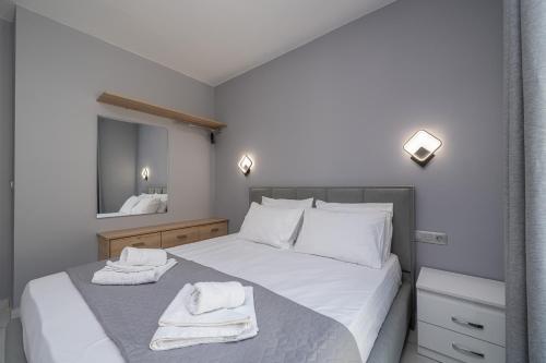 Кровать или кровати в номере Luxury Villa Ora I