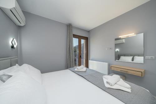 Кровать или кровати в номере Luxury Villa Ora I