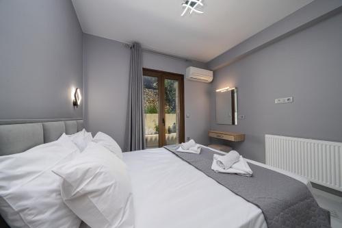 Кровать или кровати в номере Luxury Villa Ora I