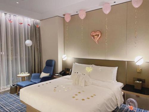 Ένα ή περισσότερα κρεβάτια σε δωμάτιο στο Onejee Hotel Shenzhen
