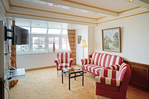 Μια τηλεόραση ή/και κέντρο ψυχαγωγίας στο Hotel Appartement Landhaus Stutzi - Hotel Strandperle