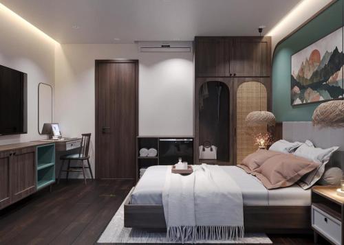 a bedroom with a large bed and a television at Sunrise Mountain View Resort in Vang Vieng
