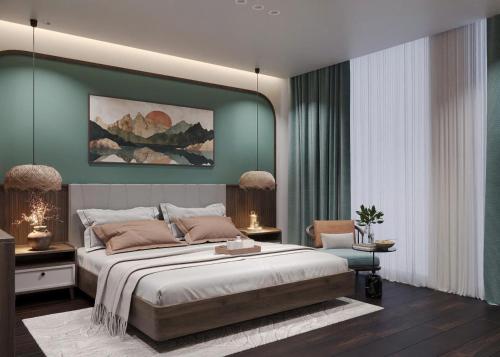 a bedroom with a large bed with green walls at Sunrise Mountain View Resort in Vang Vieng