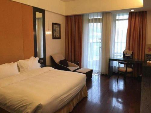 Postel nebo postele na pokoji v ubytování Xiamen SIG Resort