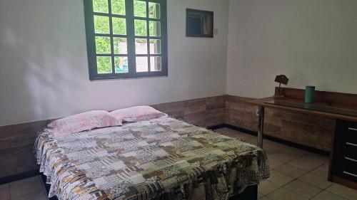 Postel nebo postele na pokoji v ubytování Quarto em casa na Mata Atlântica