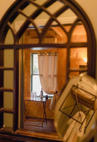 a view of a bedroom through a window at Cabernet House, an Old World Inn in Napa