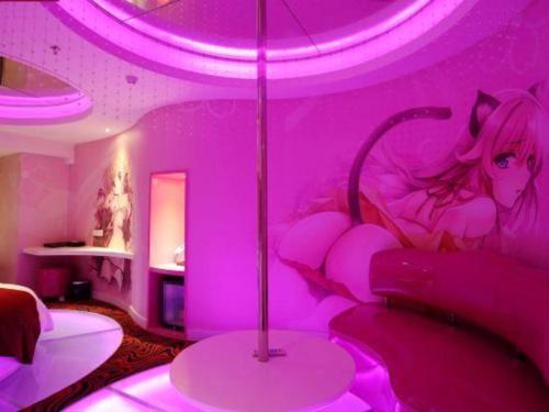 a room with a pink room with a bed in it at Grand Nest Hotel (Tang Jia Wan Beach) in Zhuhai