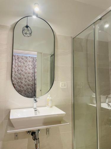 a bathroom with a sink and a mirror at Meraki in Porto SantʼElpidio
