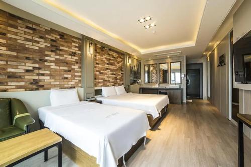 Ένα ή περισσότερα κρεβάτια σε δωμάτιο στο Pohang Hotel View