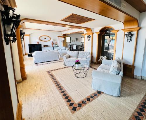 an overhead view of a living room with white furniture at Hotel Relais I Presidi in Orbetello