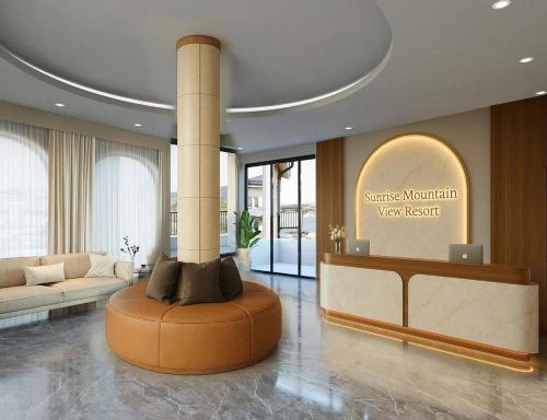 a lobby with a column in the middle of a room at Sunrise Mountain View Resort in Vang Vieng