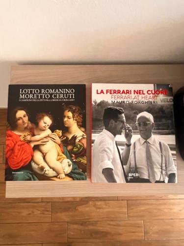 a shelf with three movie posters on it at Ma Maison Hospital University School in Brescia