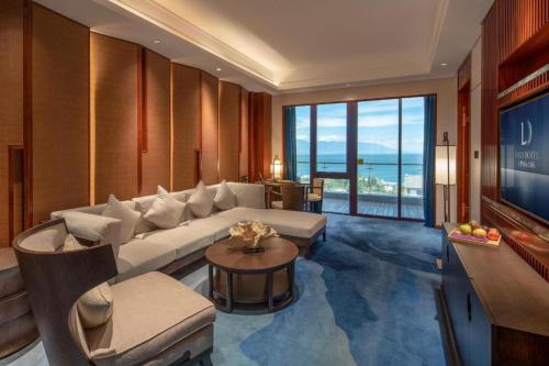 a living room with a couch and a table at Dali Hotel in Dali