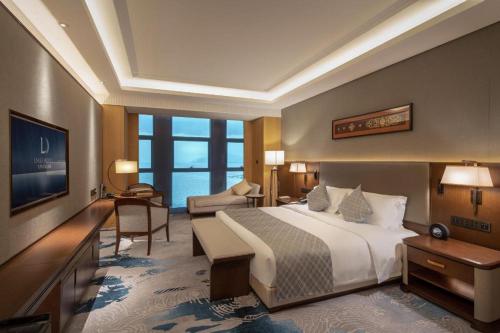 a hotel room with a bed and a large window at Dali Hotel in Dali