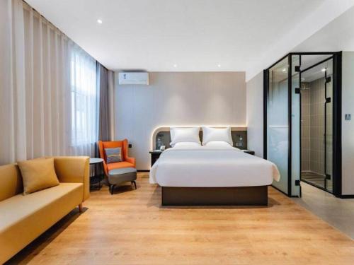 Ένα ή περισσότερα κρεβάτια σε δωμάτιο στο Jinjiang Inn Baotou Wenhua Road