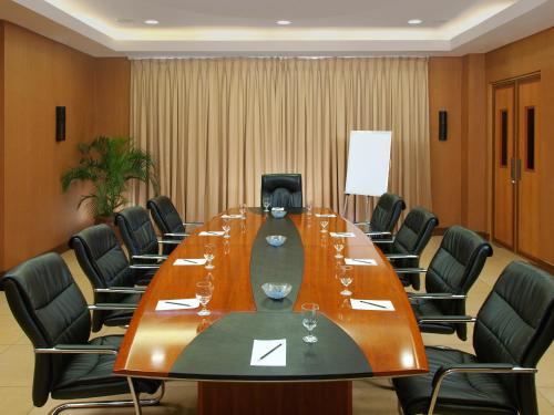 a conference room with a long table and chairs at Hotel Kimberly Tagaytay in Tagaytay