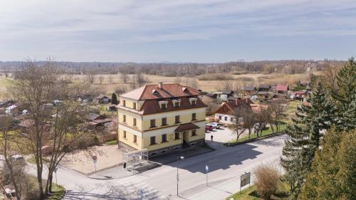 an aerial view of a large house in a town at Apartmány Na Seníku in Třeboň