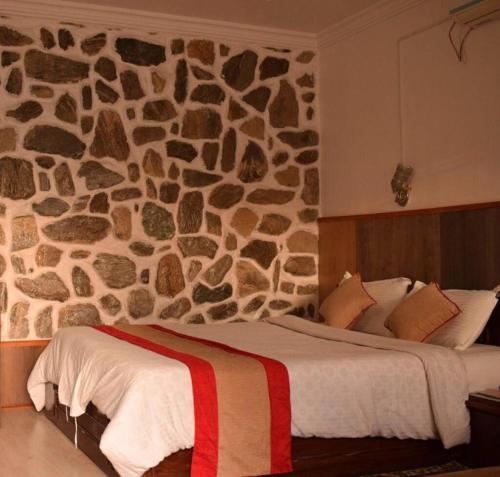 Postel nebo postele na pokoji v ubytování Stupa Resort