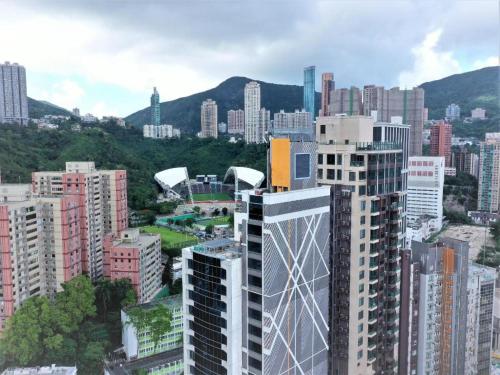 an aerial view of a city with tall buildings at Elysion Place Hotel Causeway Bay in Hong Kong