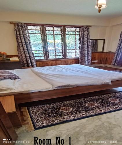 Cama o camas de una habitación en Ronglyang Villa Homestay Near MG Road