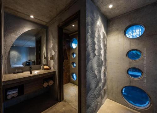 a bathroom with a sink and a mirror at Thalia Boutique Hotel Hoian in Hoi An