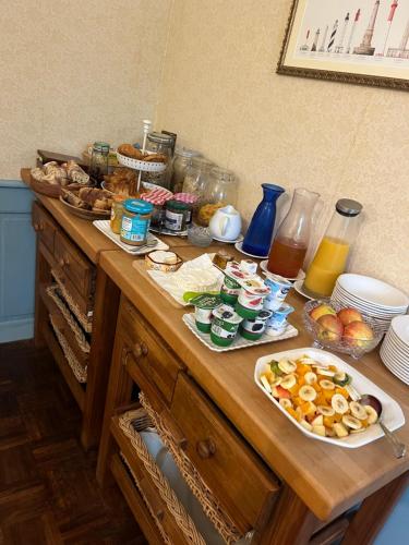 a table with a bunch of food on it at Chambres d'Hôtes Belle Vallee in Domfront