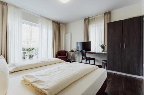 Postel nebo postele na pokoji v ubytování Hotel Bloemfontein