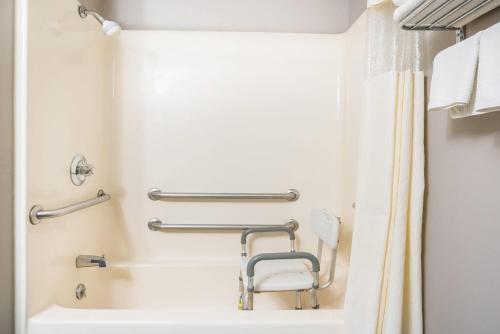 a bathroom with a sink and a shower at Days Inn & Suites by Wyndham Wausau in Wausau
