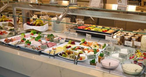 a buffet line with many different types of food at Best Western Plus Arosa Hotel in Paderborn