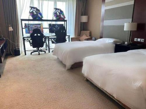 Cama o camas de una habitación en The Qube Shanghai Nanqiao
