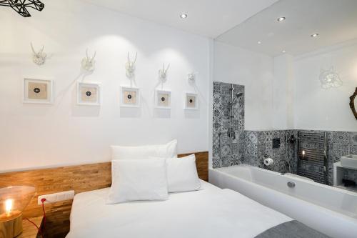 a bedroom with a bed and a bath tub at Pytloun Grand Hotel Imperial in Liberec