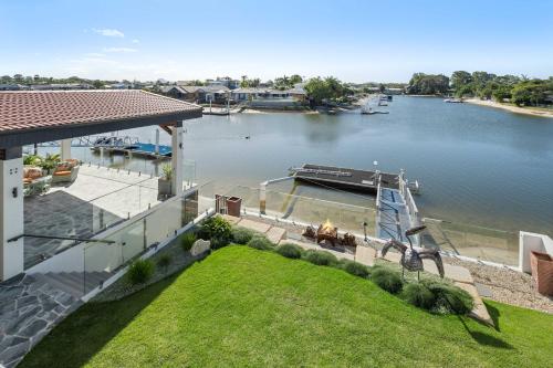 an aerial view of a house with a dock on a river at Waterfront Bliss on Maroochydore Canal in Maroochydore
