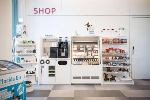a shop with an open refrigerator in a store at Scandic Berlin Potsdamer Platz in Berlin