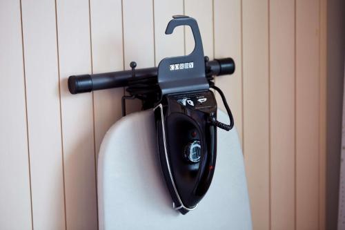 a phone is hanging on a wall at Scandic Berlin Potsdamer Platz in Berlin