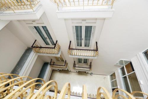 an empty room with stairs in a building at Lenid Hotel Tho Nhuom in Hanoi