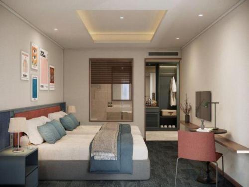 a bedroom with a large bed and a bathroom at Lenid Hotel Tho Nhuom in Hanoi