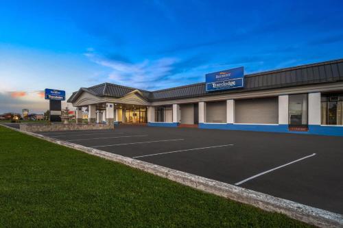 an empty parking lot in front of a building at Baymont by Wyndham Salisbury MD in Salisbury
