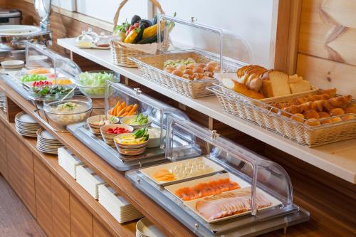 a buffet line with many different types of food at The Prince Villa Karuizawa in Karuizawa