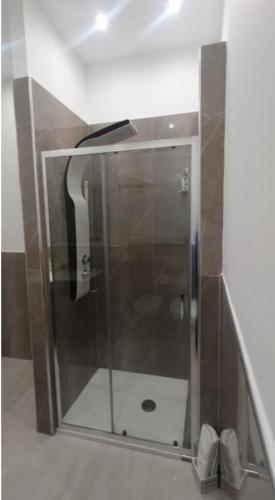 a shower with a glass door in a bathroom at B&B Carpe Diem in Palermo