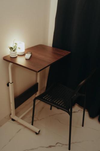a desk with a chair and a table and a table and a chair at Cozy Nest in Bhubaneshwar