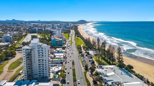 an aerial view of a beach and the ocean at Mandolin Beachfront Resort in Alexandra Headland