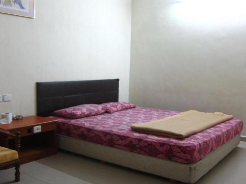 Кровать или кровати в номере Skudai Baru Hotel