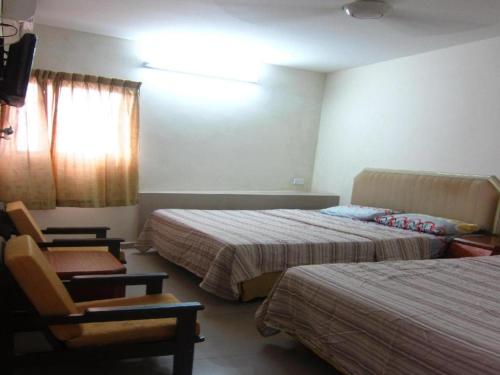 Кровать или кровати в номере Skudai Baru Hotel
