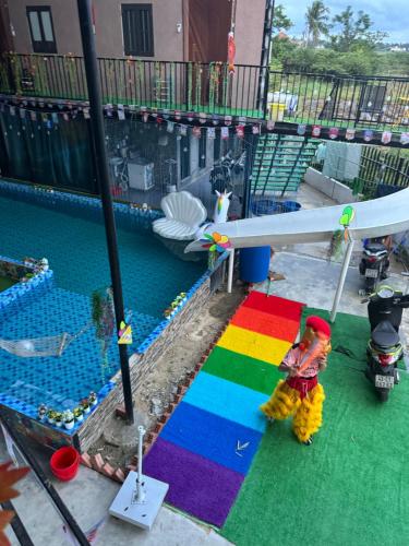 a view of a pool with a rainbow colored rug at Happy House TB in Thăng Bình