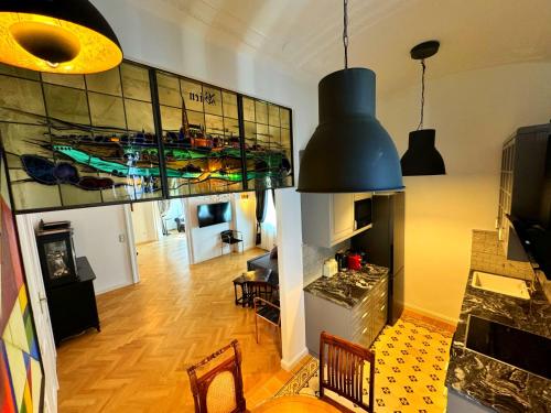 a living room with a kitchen and a dining room at 7th HEAVEN Vienna Center Apartments in Vienna