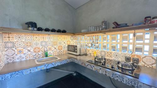 Η κουζίνα ή μικρή κουζίνα στο Kenan Cottage