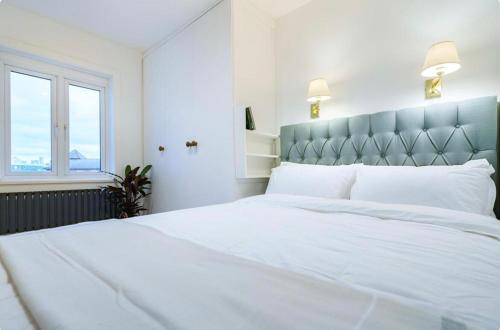 Katil atau katil-katil dalam bilik di Stylish and Spacious Peckham Flat