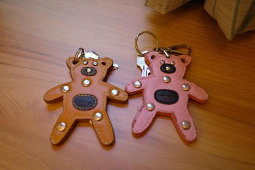 two gingerbread cookies are on a wooden floor at Meinong Yun Shanju Homestay in Meinong